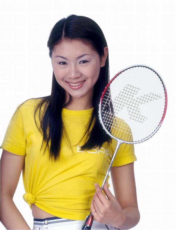 东方女人图片-人物图 羽毛球拍 黄色上衣 运动